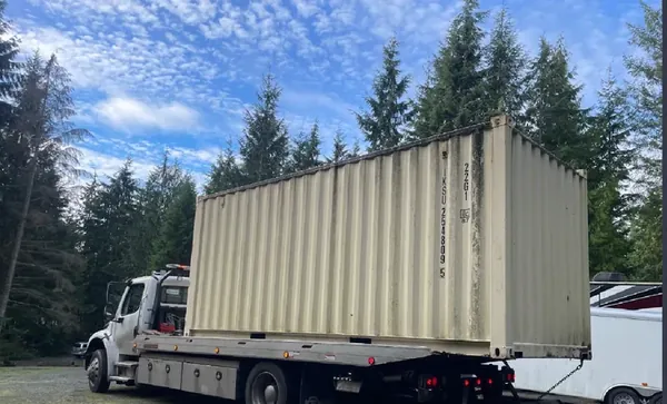 Shipping container on a flatbed