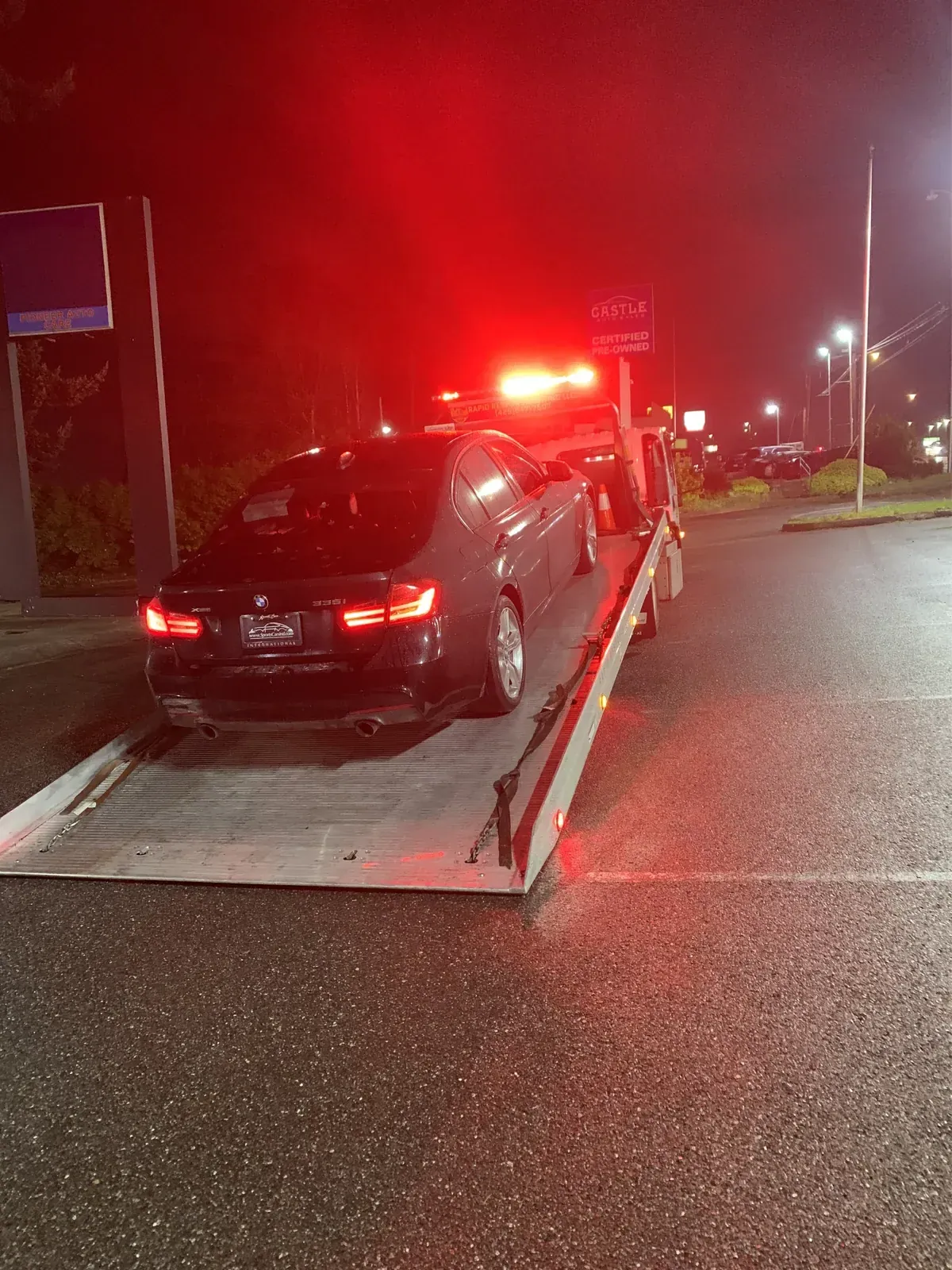 Flatbed tow at night near Maple Valley