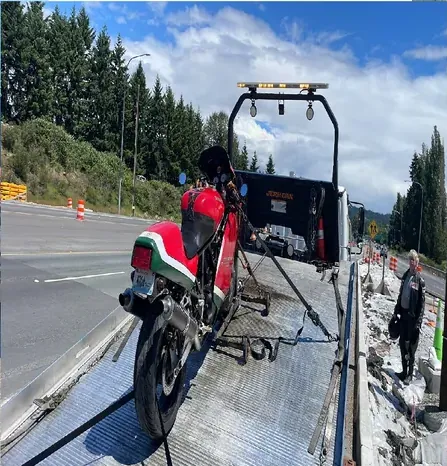 Motorcycle strapped down on a flatbed